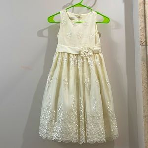 Beautiful dress with a ribbon for 8-year old girl.
